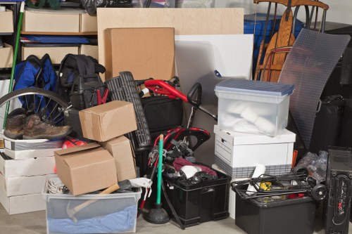 Furniture and electronics being removed during office clearance